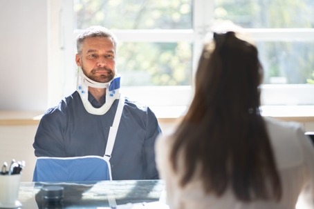 Injured man consults with an attorney in an office